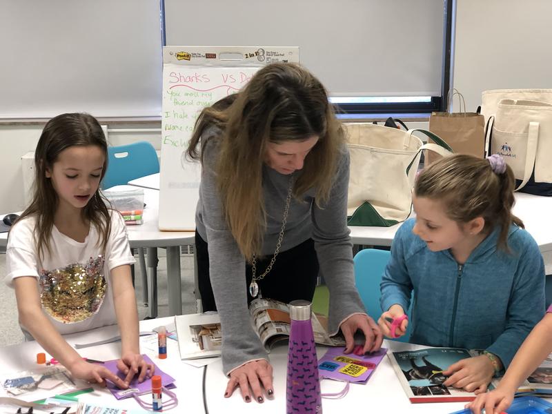 Jen Morris working with students on a collage project