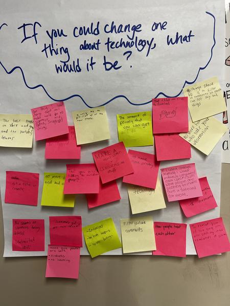 Posterboard showing post it answers to the question, if you could change one things about technology, what would it be